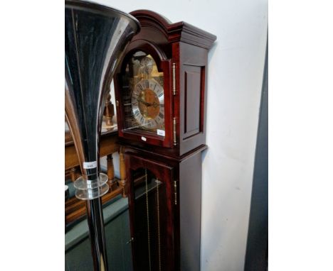 A mahogany cased chiming grandmother clock with brass dial inscribed 'Tempus Fugit'. 