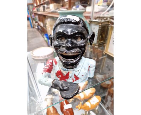 A Jolly Boy cast money box These items are listed on the basis they are illustrative of a bygone culture in which there were 