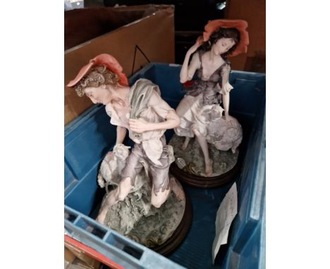 Two ceramic figurines, shepherd and shepherdess. 