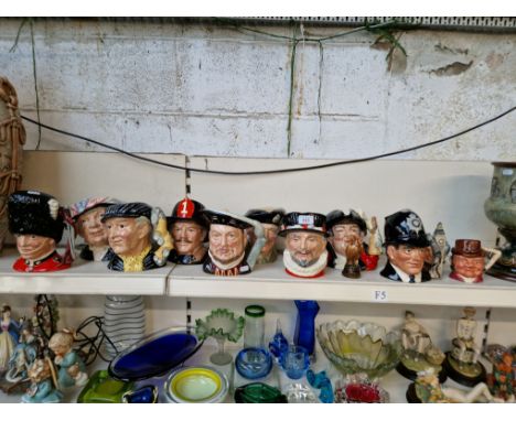 Nine large and one small Royal Doulton character jugs together with a Stirling character jug and a Beswick eagle containing B