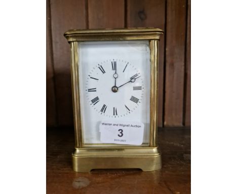 A brass cased carriage clock
