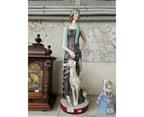 A large art deco style ceramic figure of lady with greyhound - height appx 65cm including base 