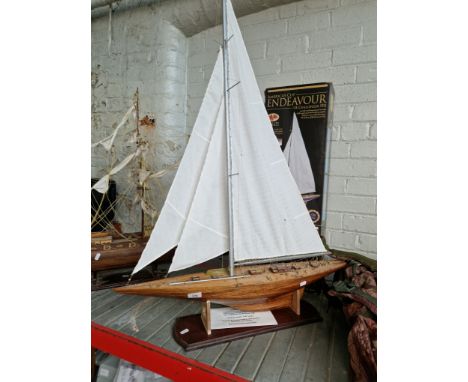 A 1:50 scale model of Endeavour, UK Challenger for Americas Cup 1934. Stands on plinth, total length 80cm 