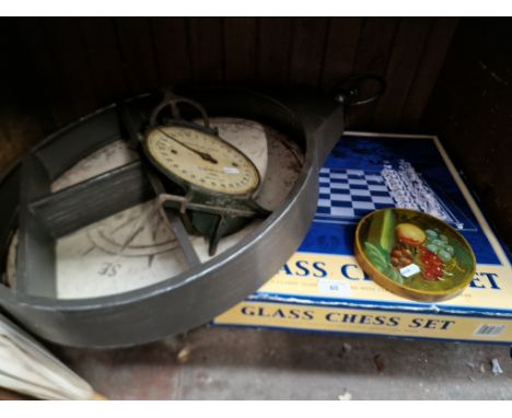 A set of vintage weighing scales (no pan), a boxed glass chess set, and a wall display item with a compass background 