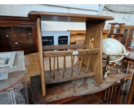 A modern Ercol elm magazine table. 