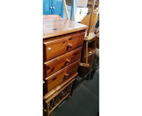 Various items of furniture; a pine chest of drawers, a canework blanket box, a cane and glass coffee table, a mid 20th centur