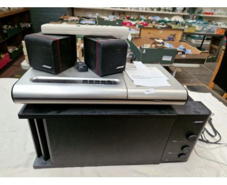 A BOSE lifestyle model 5 music centre (with remote), a BOSE powered acoustimass 3 series II speaker system &amp; a wireless b