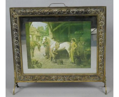 A Brass Framed Fire Screen with Blacksmith Print Interior, 57cm Wide 