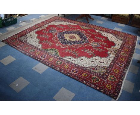 A Large Patterned Carpet Square on Red Ground, 370cm x 300cm 