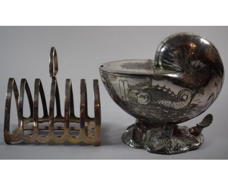 A Silver Plated Six Slice Toast Rack Together with a Silver Plated Nautilus Shell Spoon Warmer with Engraved Dolphin Decorati