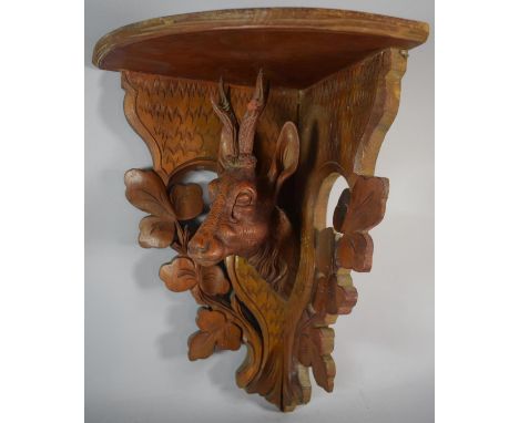 A Carved Black Forest Corner Wall Shelf mounted with Stag, Antler AF, 36cm High 