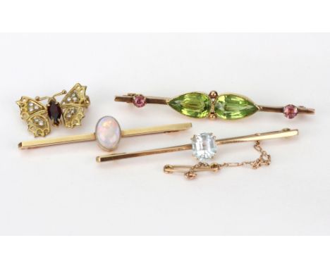 Four bar brooches; comprising; an early 20th century gold pear-shaped peridot two stone bar brooch with small pink tourmaline