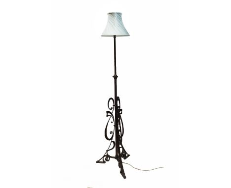 An Art Nouveau gilt metal telescopic cylindrical column standard lamp, adapted for electricity, with scrolled wrought ornamen