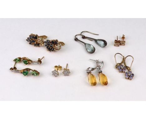 Seven pairs of mostly gold and gem set earrings, comprising; a pair of spiral-facetted citrine drops with small diamond caps 