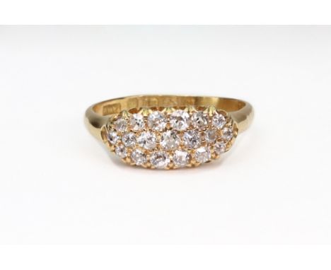 A Victorian 18ct gold and diamond oval cluster ring, pave set with 19 old-cut diamonds approx. 0.90cts total, on a plain shan