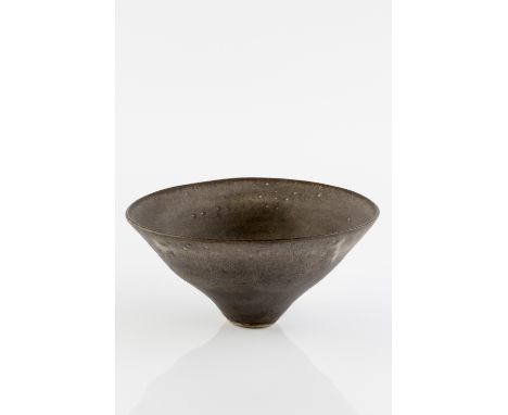 Lucie Rie (1902-1995) Bowl, circa 1960 conical form, dark tones of grey with subtle white spots impressed potter's seal 10.6c