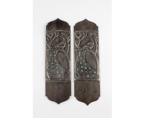 Arts & Crafts Pair of finger plates decorated with peacocks sitting upon a branch pewter mounted onto wood, inset foil-backed