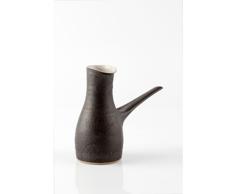 Lucie Rie (1902-1995) Pouring vessel matt black glaze impressed potter's seal 12.5cm high, 16cm across. Provenance: Kenneth M
