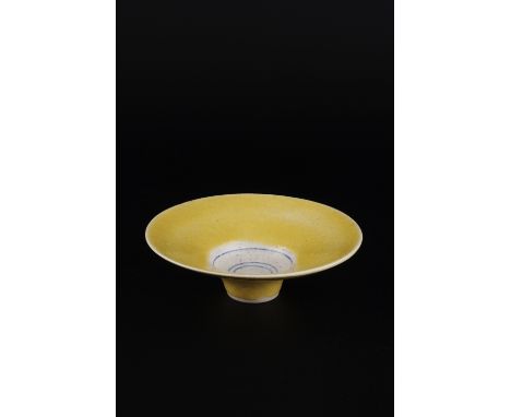 Lucie Rie (1902-1995) Bowl, circa 1965 yellow glaze, white centre with three circles of blue impressed potter's seal, exhibit