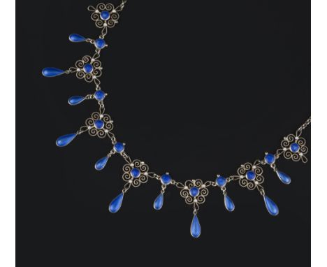 Marius Hammer (Norwegian, 1847-1927) Enamel fringe necklace comprising openwork scrolled panels, suspending a tiered fringe o