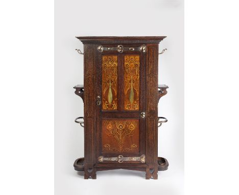 Shapland and Petter of Barnstable  Art Nouveau inlaid 'Peacock' hall cabinet, circa 1905 the central door inlaid with panels 