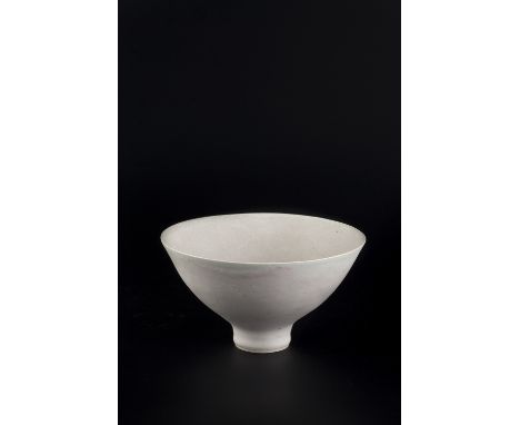 Lucie Rie (1902-1995) Footed bowl pale pink and white glaze impressed potter's seal 10cm high, 18.5cm diameter. Provenance: A