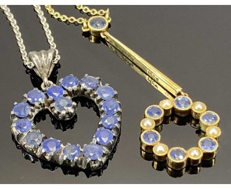 TWO BLUE SAPPHIRE SET NECKLACES the first being in 15ct yellow gold, the fine link necklace with single lower round blue face
