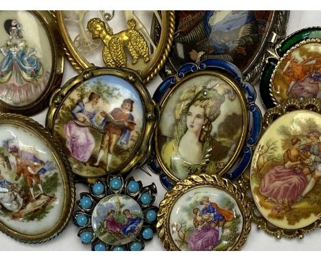 TEN CERAMIC &amp; OTHER ROMANTIC VIGNETTE BROOCHES the largest being in Sterling silver with printed image of a lady After Ga