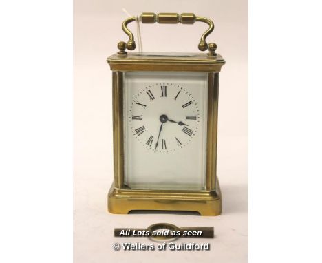 A Brass Carriage Clock, The White Enamel Dial With Roman Numerals, Leather Carry Case And Key, Front And Rear Glass Panels Ar