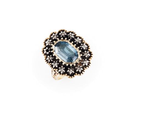 A ring  Gold and silverSet with one light blue faux stone and 14 rose cut diamondsEurope, ca. 1940Unmarked in compliance with