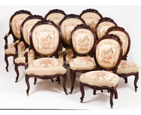 A Napoleon III salon setSettee, six fauteuils and four chairsDarkened woodCarved decoration of floral motifs and tapestry uph