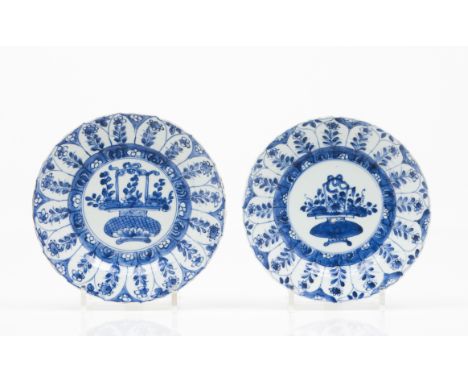 A pair of Kangxi platesChinese export porcelainBlue underglaze decoration of central flower vasesFloral decoration to lipMark