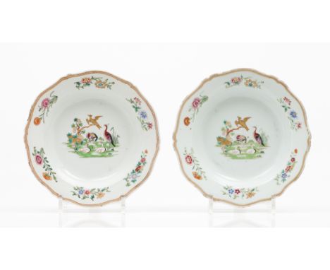 A pair of deep platesChinese export porcelainPolychrome "Famille Rose" enamelled decoration of landscape with fruits and bird