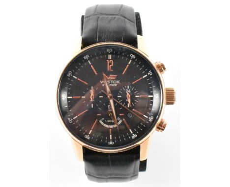 A Vostok Europe limited edition chronograph water resistant wrist watch. The watch having a round black face with rose gold t