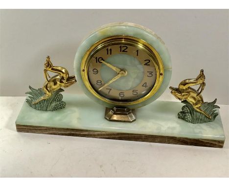 Art deco marble and brass mantel clock green marble base with 2 rearing brass deers measures approx 9" high by 16" width 