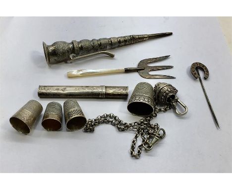 Collection of silver items includes silver thimbles needle posy flower holder  stick pin etc 