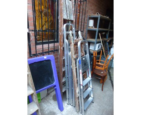 Three aluminium step ladders and two wooden step ladders