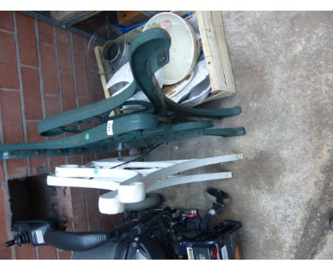 Two pairs of wrought iron bench ends