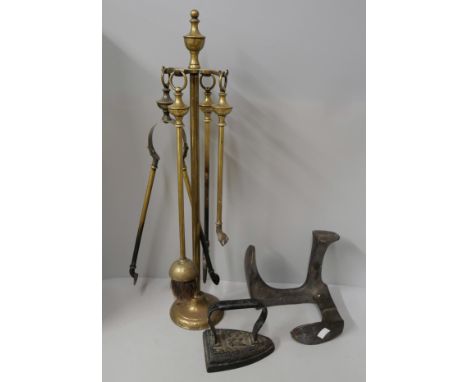 A lot of cast iron and brass fire place tools 
