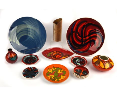 Poole, Collection of pottery pieces, to comprise two chargers, 36cm and 35cm diameter, a leaf shaped dish, 30cm long, plate (