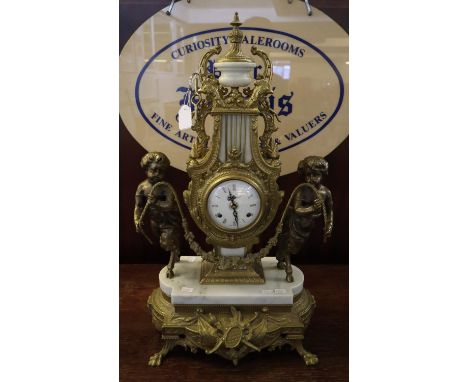 20th Century French design brass and marble figural mantel clock, the lyre shaped case with two satyr supporters, enamelled R