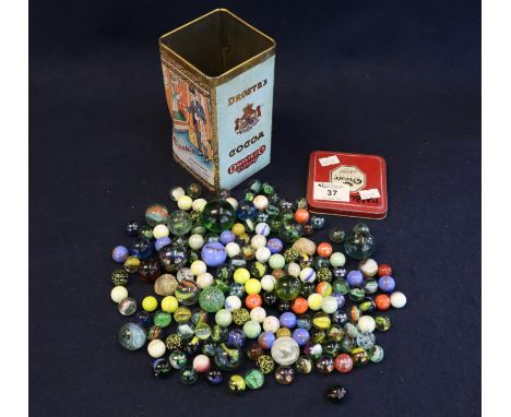 A Dutch vintage tin chocolate box 'Droste's bon-bons chocolade pastilles' containing a large collection of glass marbles, var