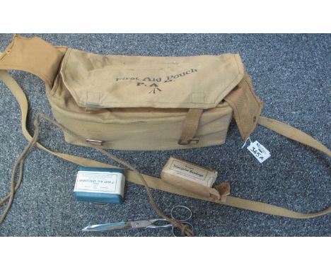 British military first aid pouch with contents, printed initials P.A.D. and crows foot mark. (B.P. 21% + VAT) No maker's name