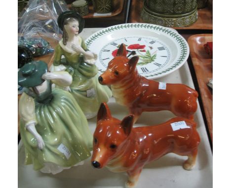 A pair of ceramic Corgi dogs, together with two Royal Doulton bone china figurines 'Buttercup' HN2309 and 'Sandra' HN2401 and