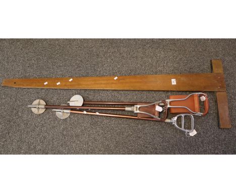 Large mahogany set square and three vintage shooting sticks.(B.P. 21% + VAT) 