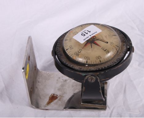 A Suunto boat compass with stainless steel bracket