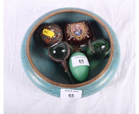 A pair of handmade glass and iron door pulls, two ruby glass trinket boxes with enamelled decoration, an ovoid green glass sc