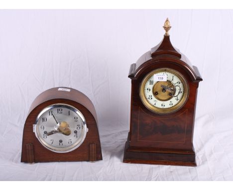 A Georgian design mantel clock in arch top mahogany case with pineapple finial, 18" high, and a mid 20th Century mantel clock