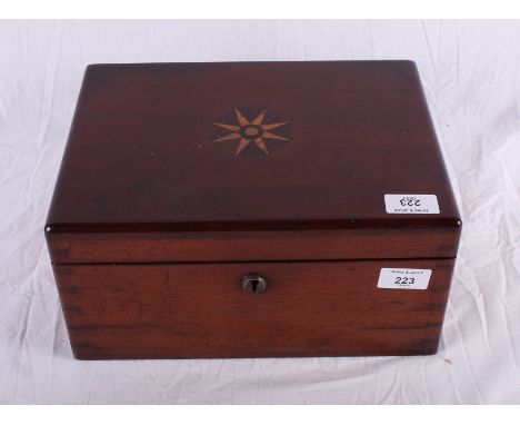 A late 19th Century mahogany sewing box, lid decorated compass design, with fitted interior