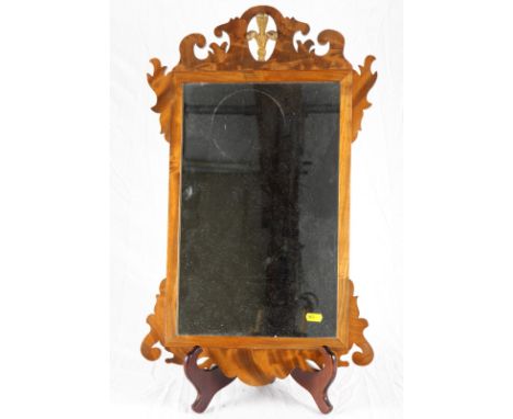 A George III design wall mirror in fretted frame, 24" x 15", and a two-tier wall shelf